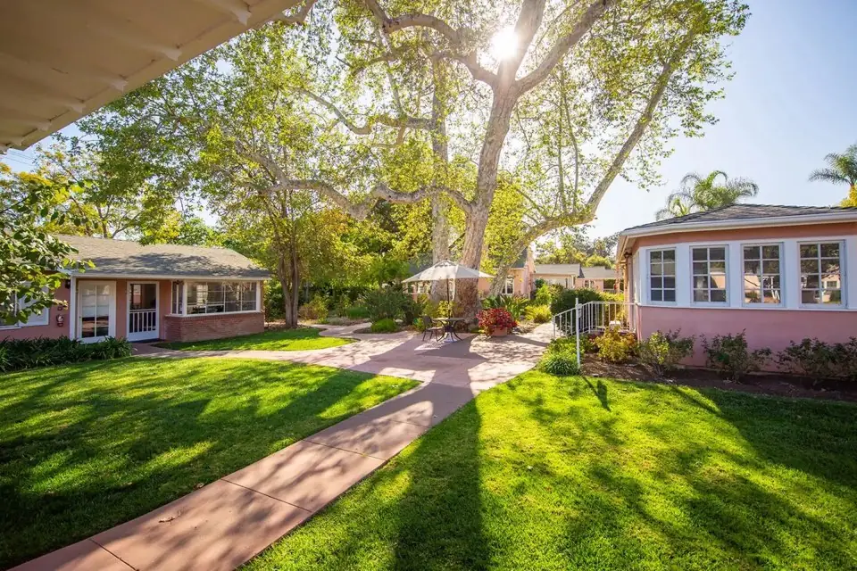 Sunny courtyard, walking paths, and residences at The Gables of Ojai
