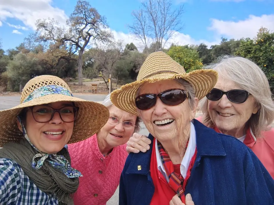 Gables residents smiling together outdoors