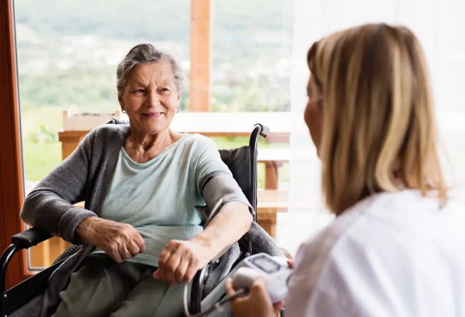 Senior receiving attentive support during a short-term stay